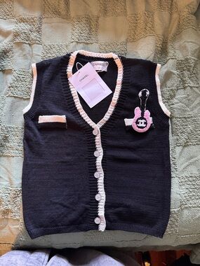 CHANEL Black Knit Vest with Pink Trim and Logo Charm